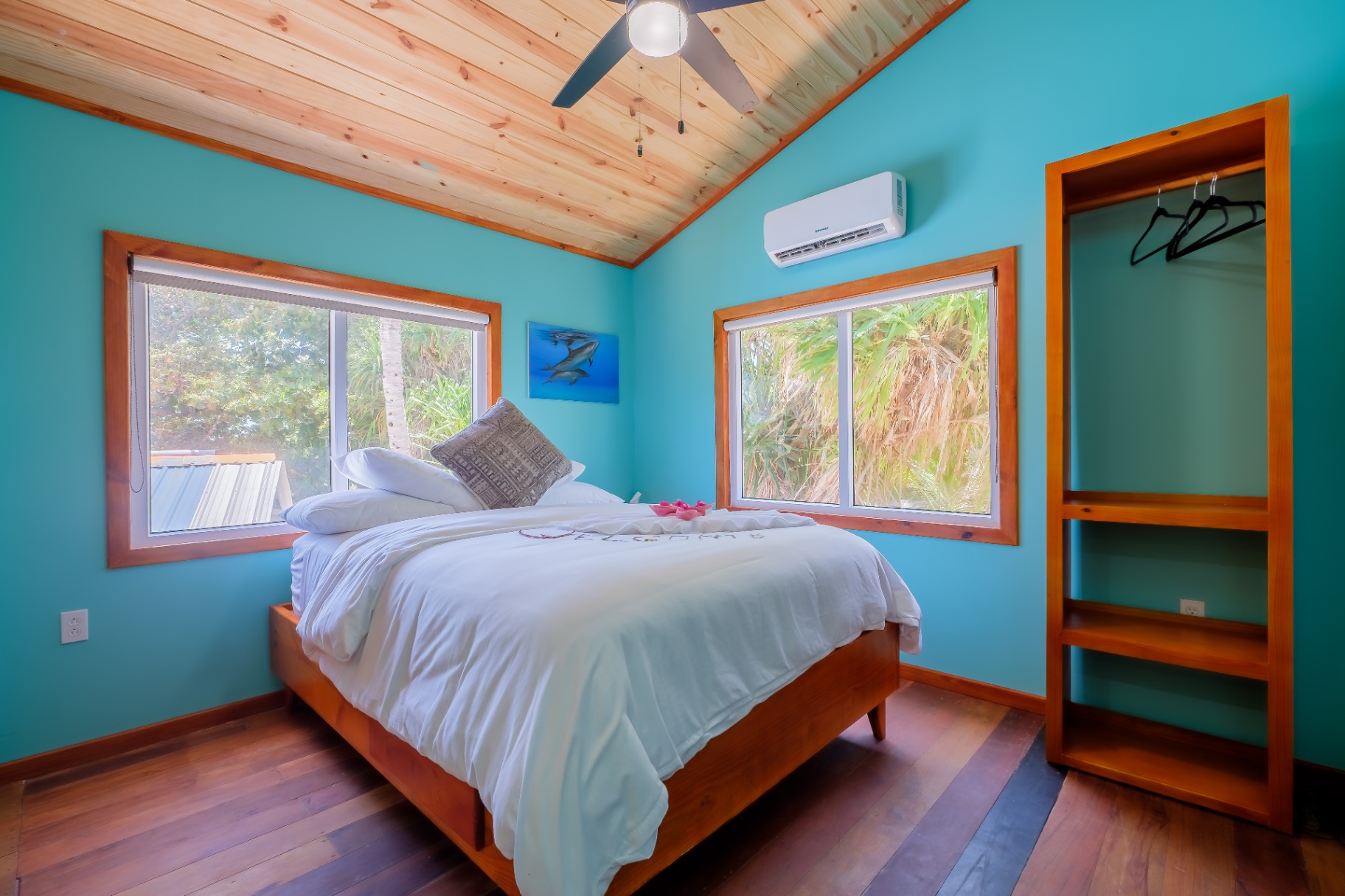 Queen bedroom with vaulted ceiling and garden views