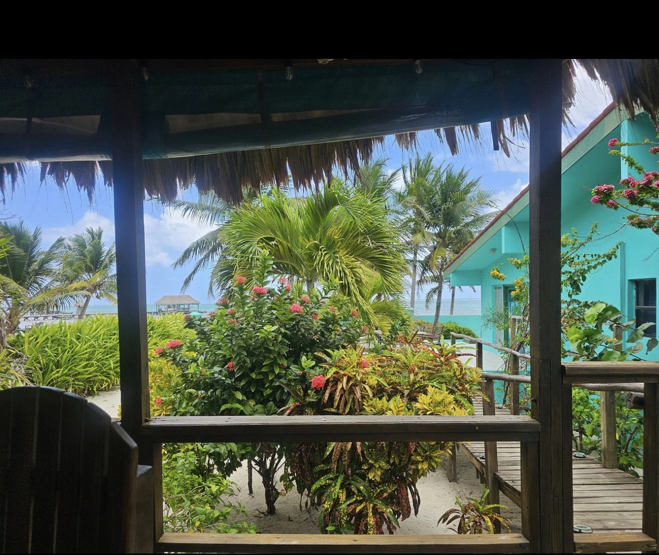 Veranda view across lush tropical gardens toward the beach at Playa Blanca