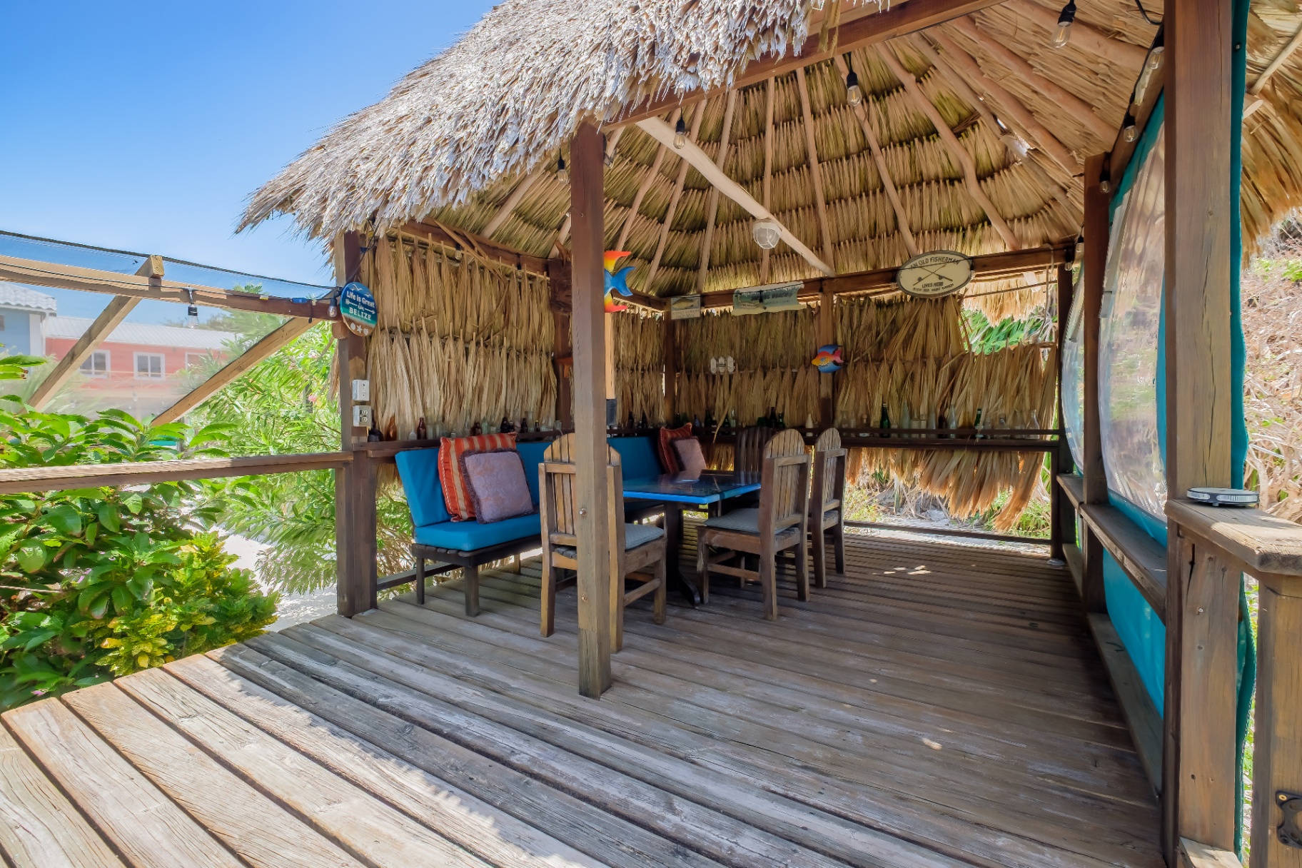 Thatched palapa lounge with built-in seating