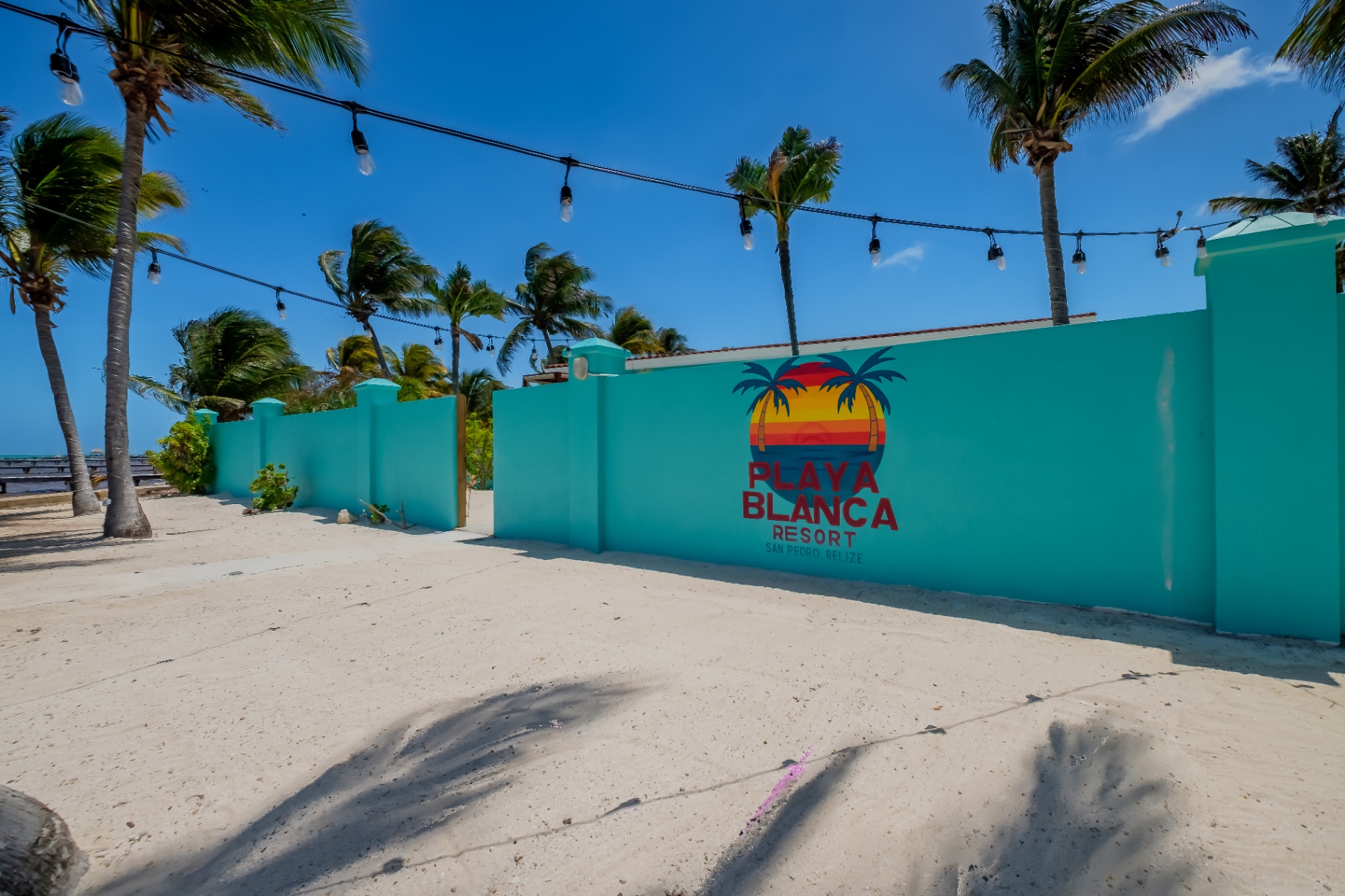 Playa Blanca Resort signed wall with string lights