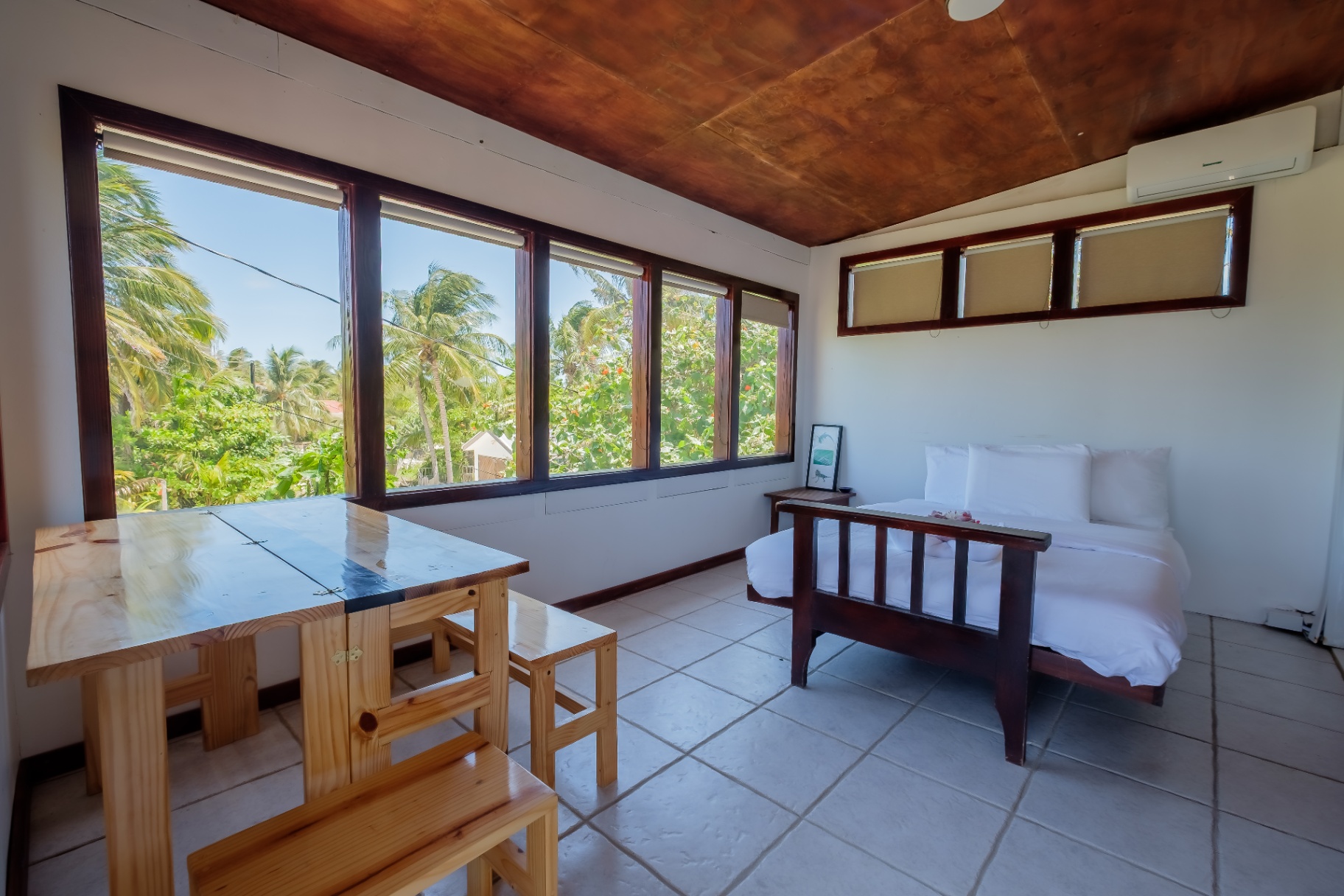 Sunroom with wraparound windows and copper ceiling