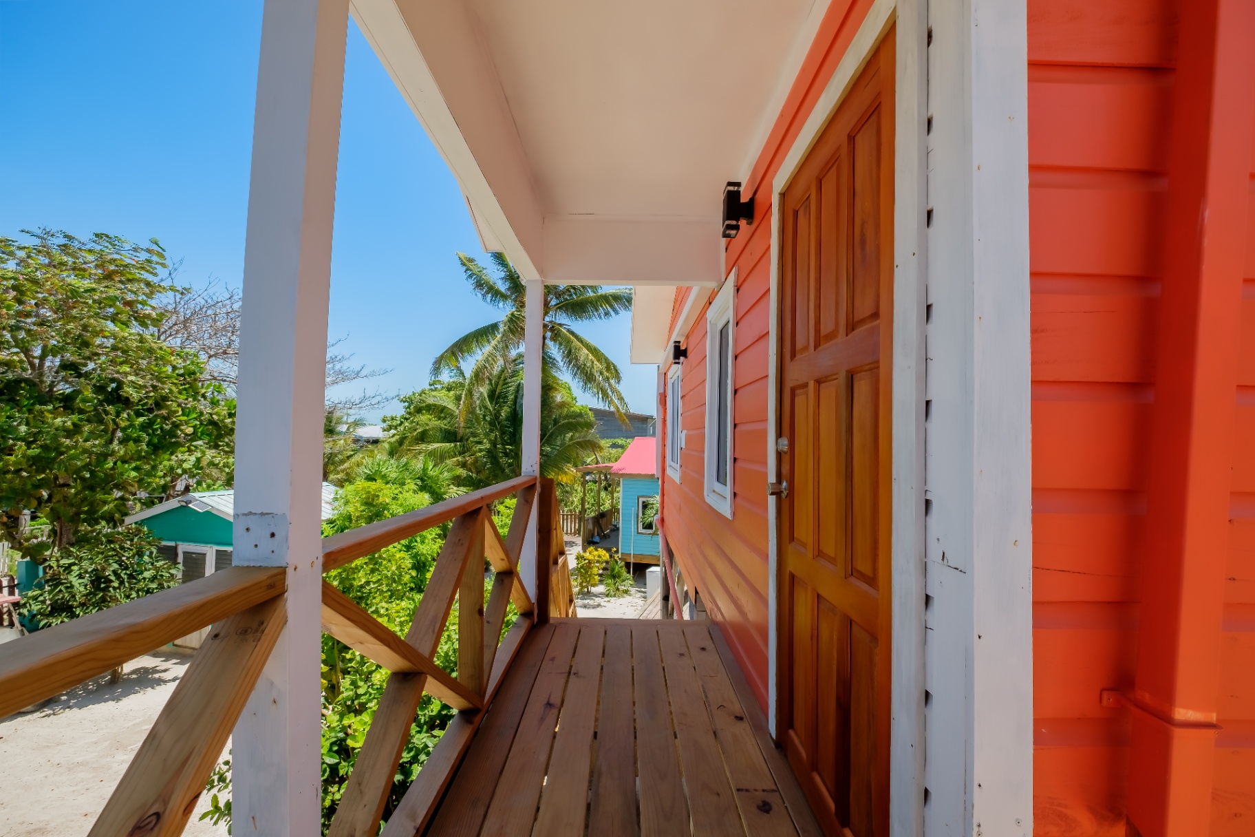 Private upper porch entry with palm and ocean breeze