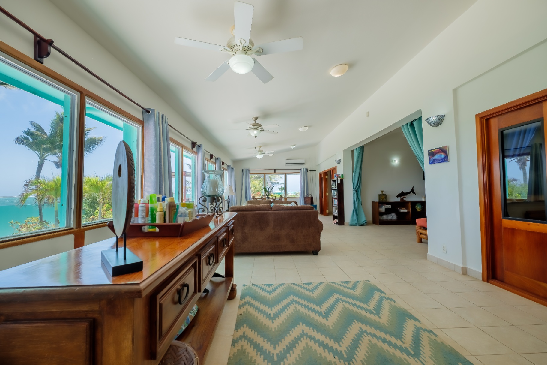 Living room with floor-to-ceiling sea-view windows