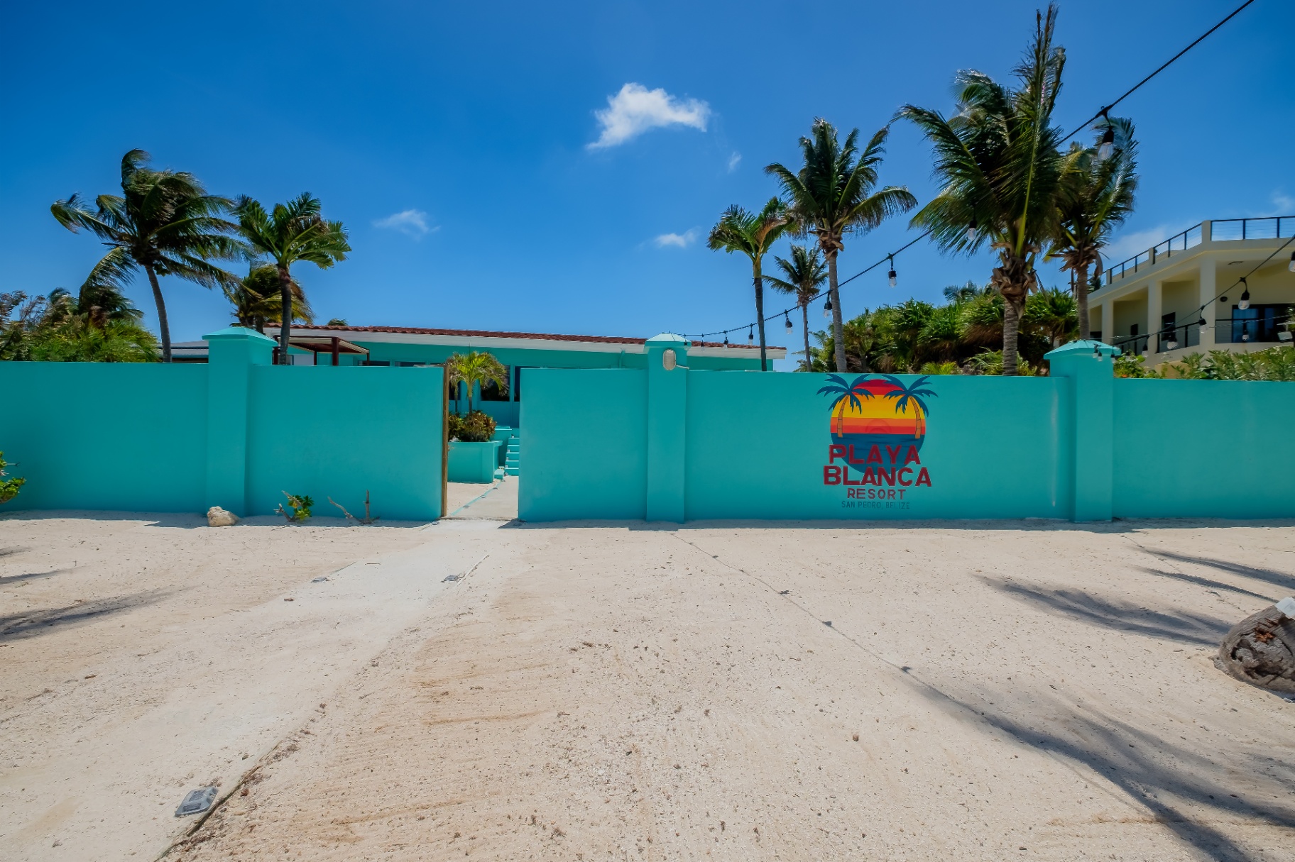 Playa Blanca Resort entrance gate with palms