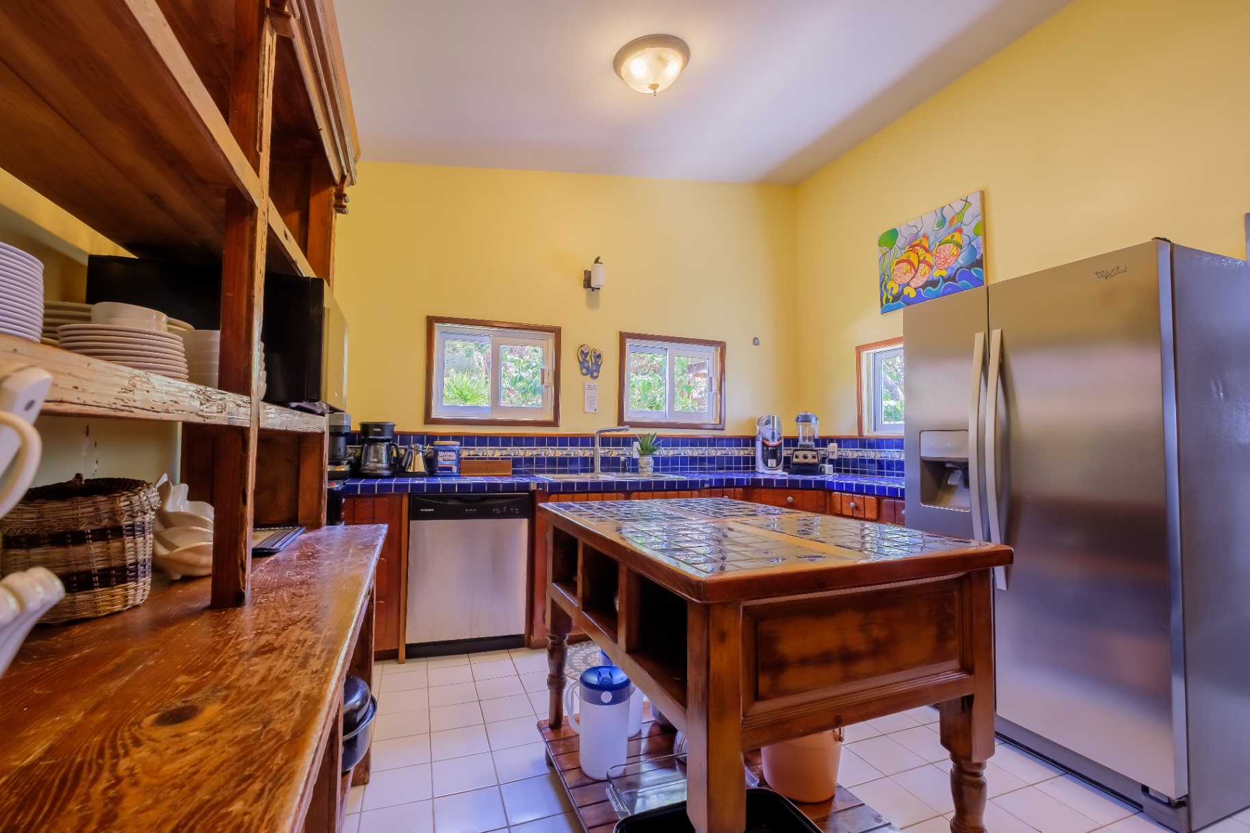 Full chef's kitchen with blue tile counters