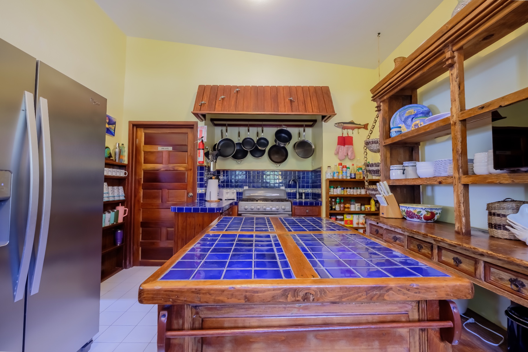 Chef's kitchen with cobalt blue tile island