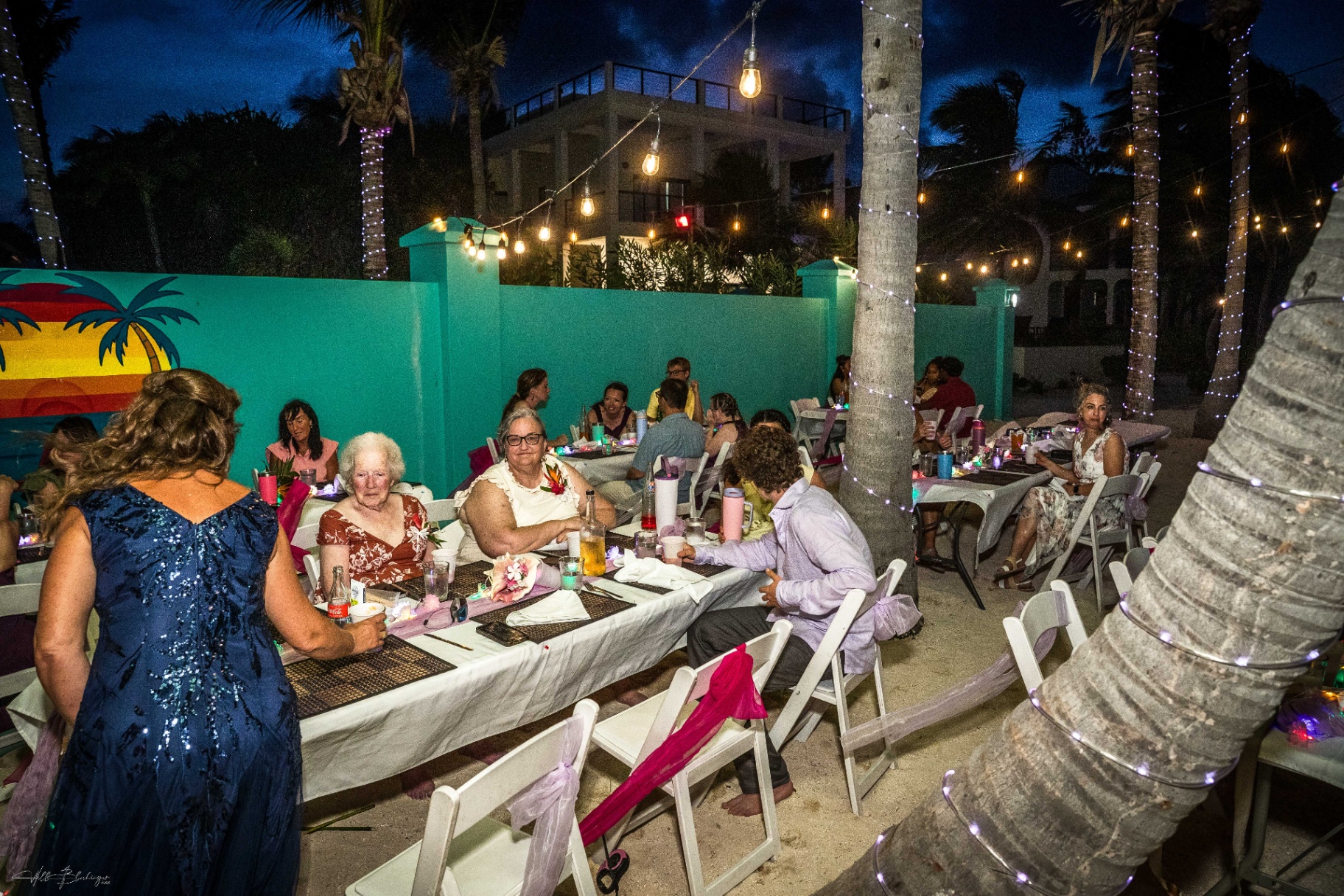 Evening reception dinner under string lights at Playa Blanca