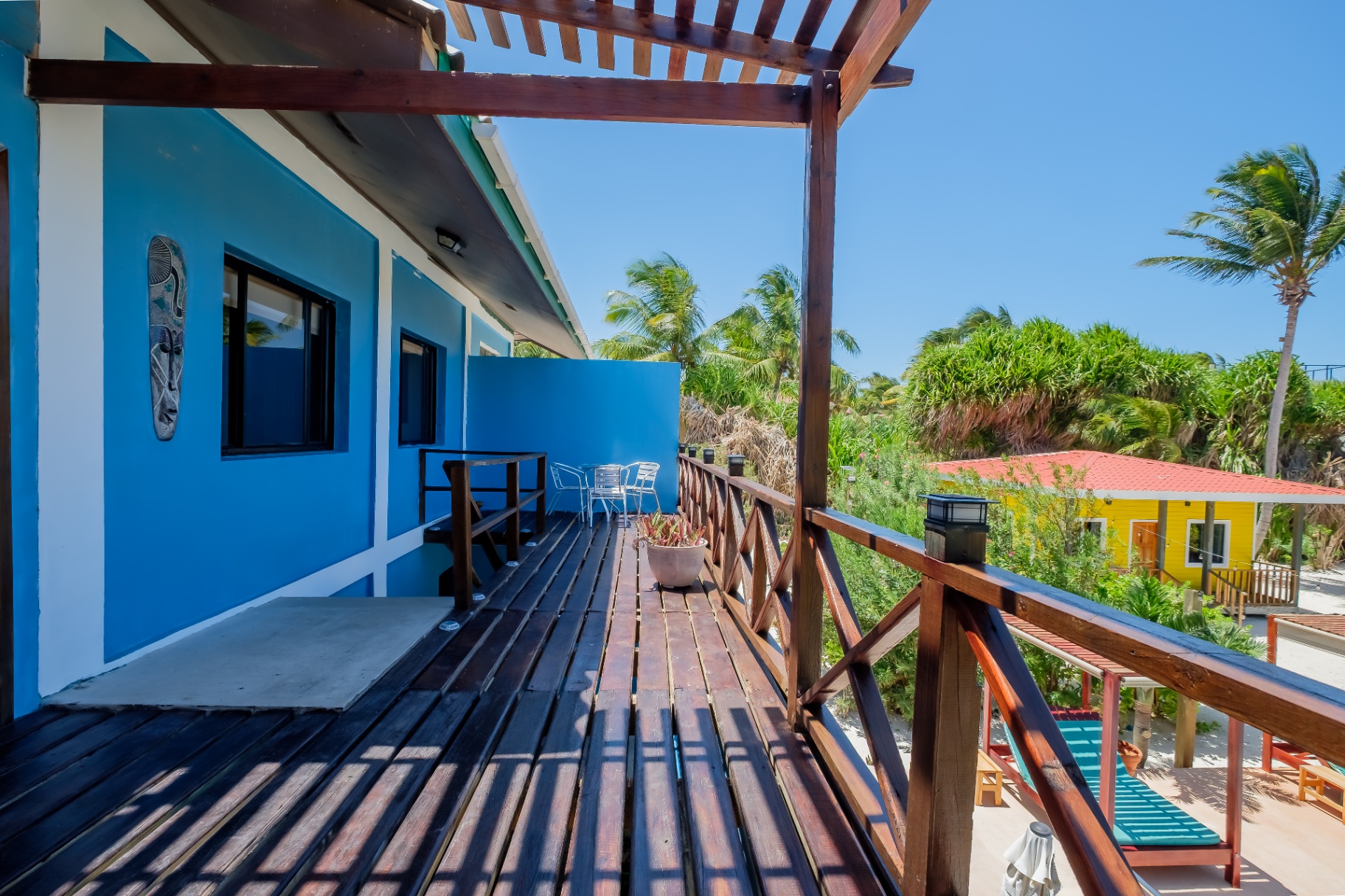 Upper balcony of the Blue House with pergola shade