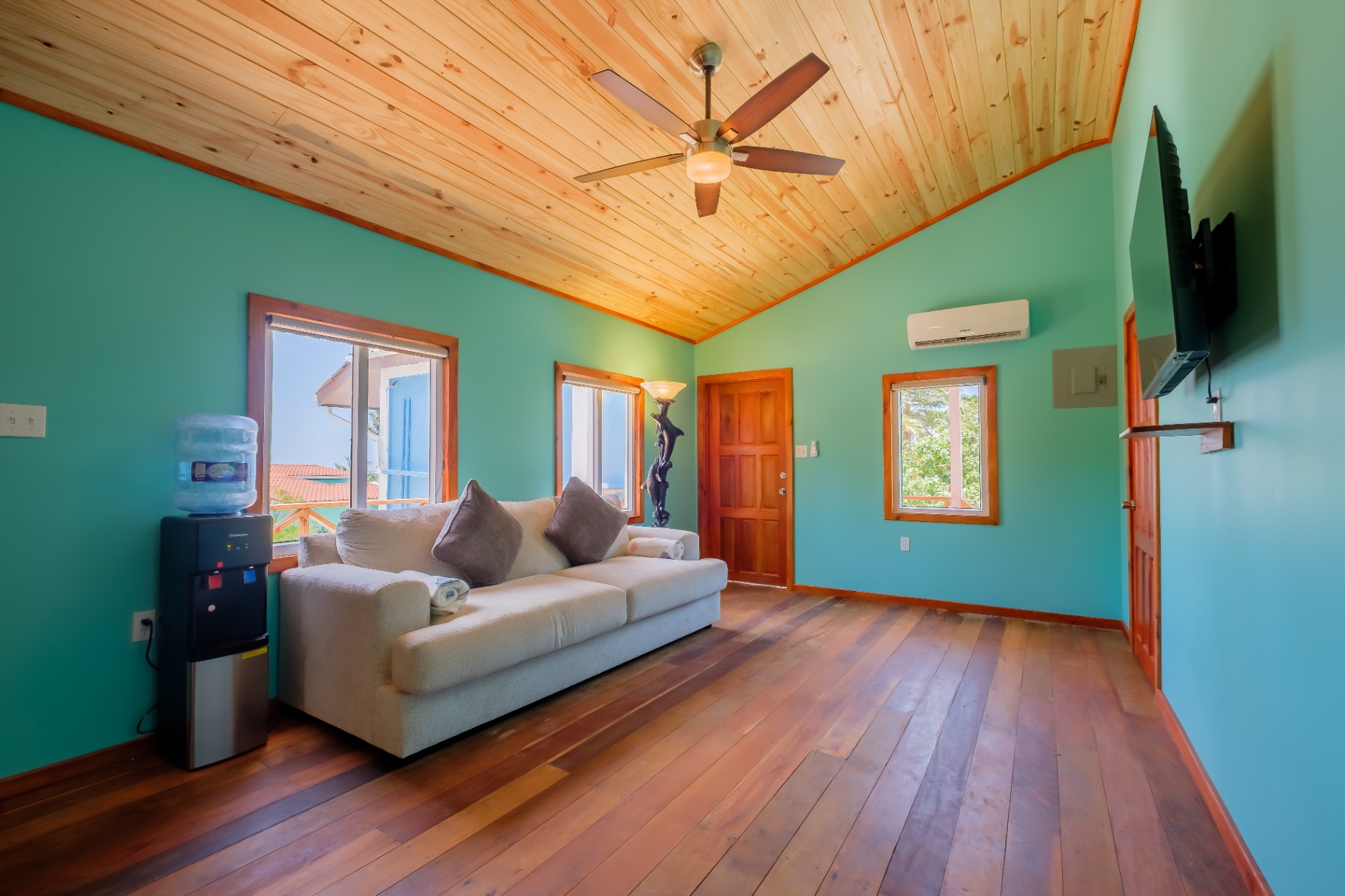 Living area with vaulted ceiling and ocean-view windows