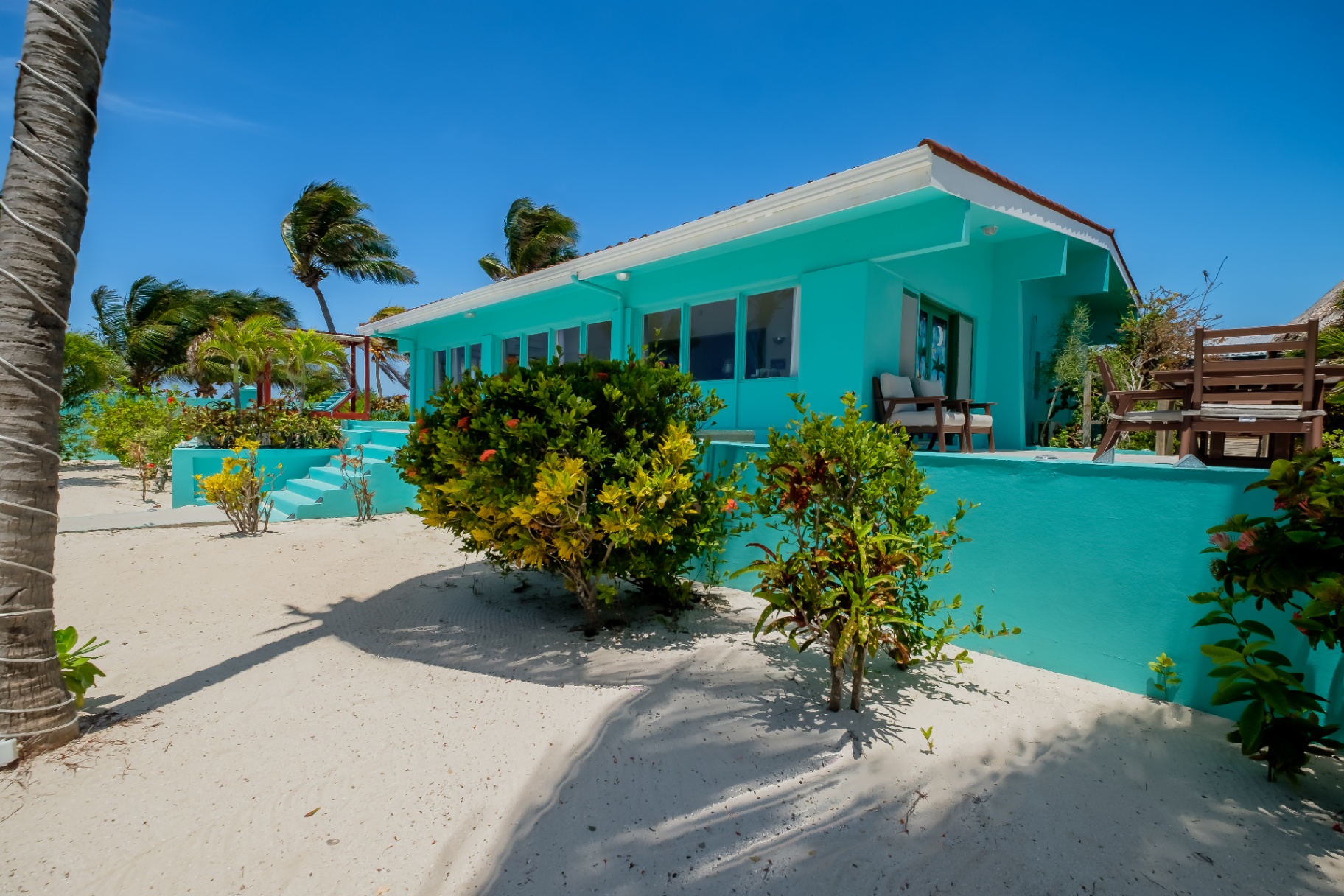 Side exterior of the turquoise Beach House