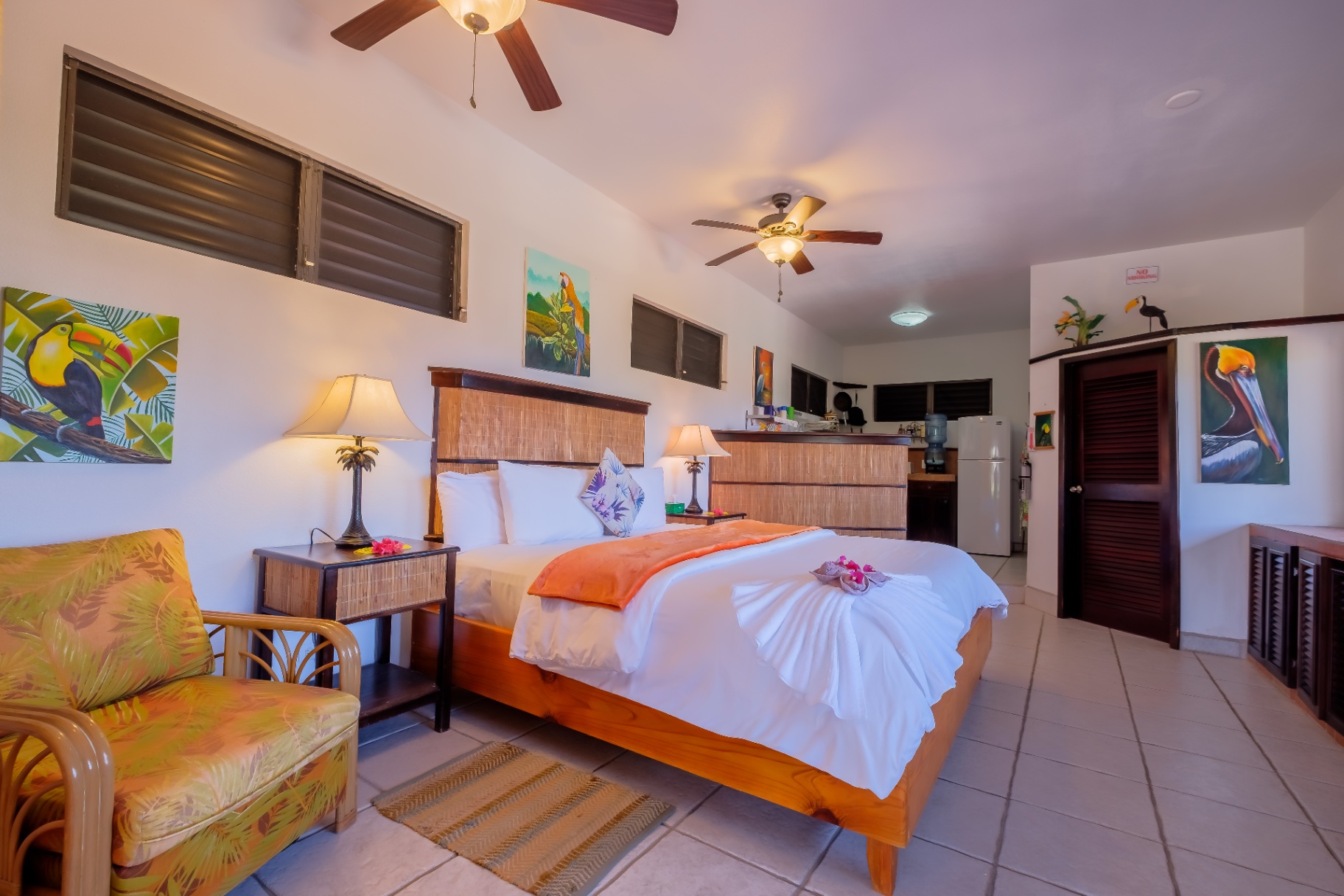 Studio bedroom with toucan and pelican paintings