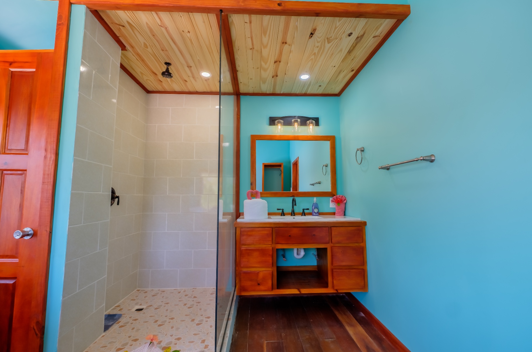 Turquoise bathroom with walk-in tiled shower