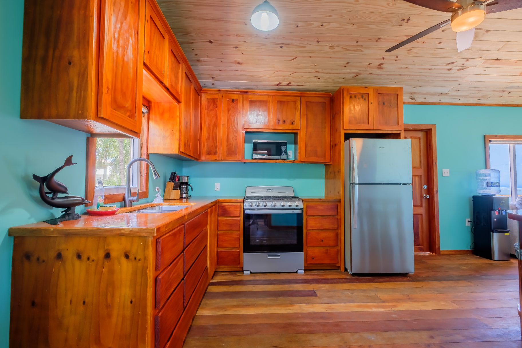 Full kitchen with hardwood cabinetry and gas range