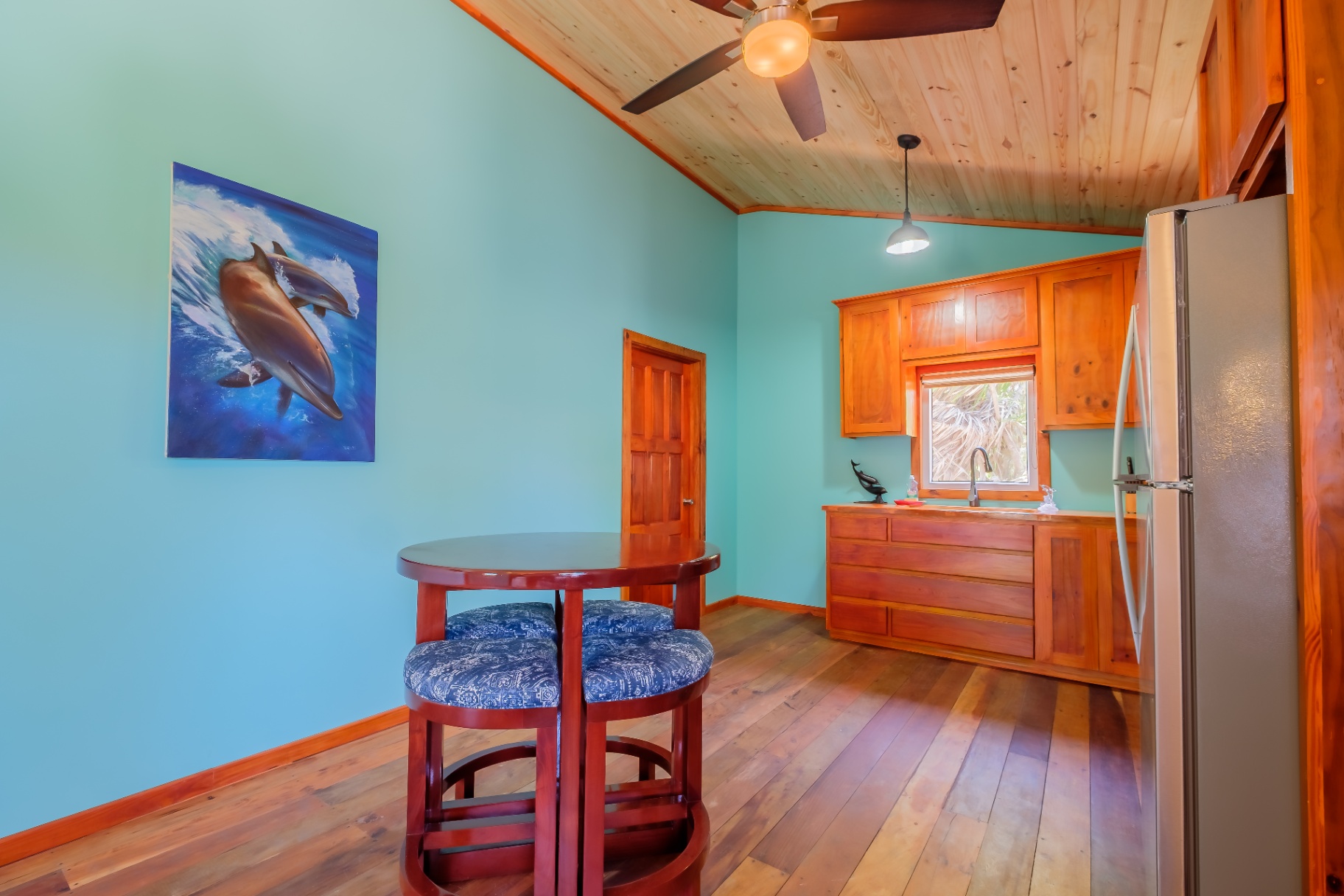 Dining area with signature dolphin painting