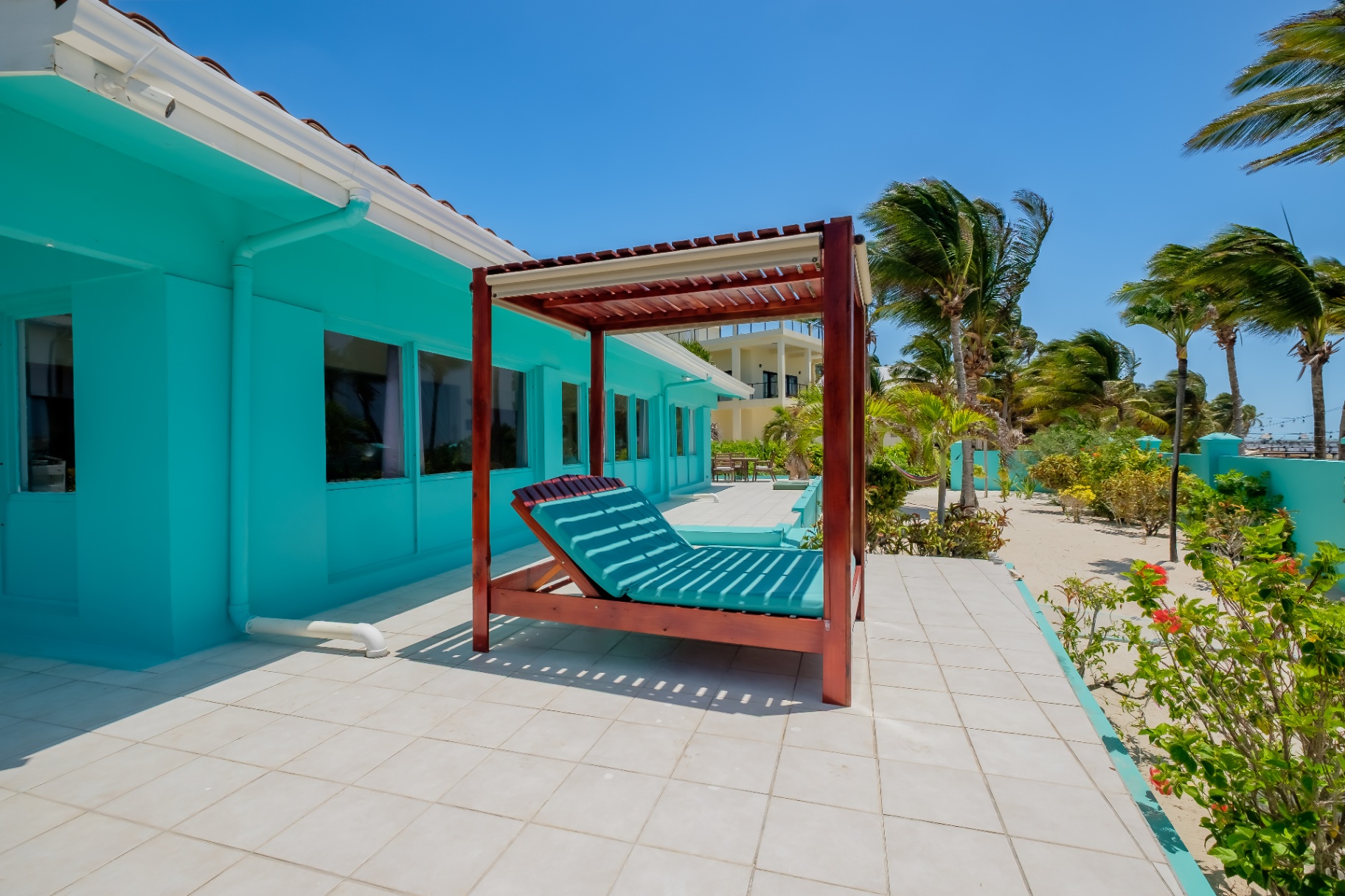 Shaded daybed on the beachfront patio