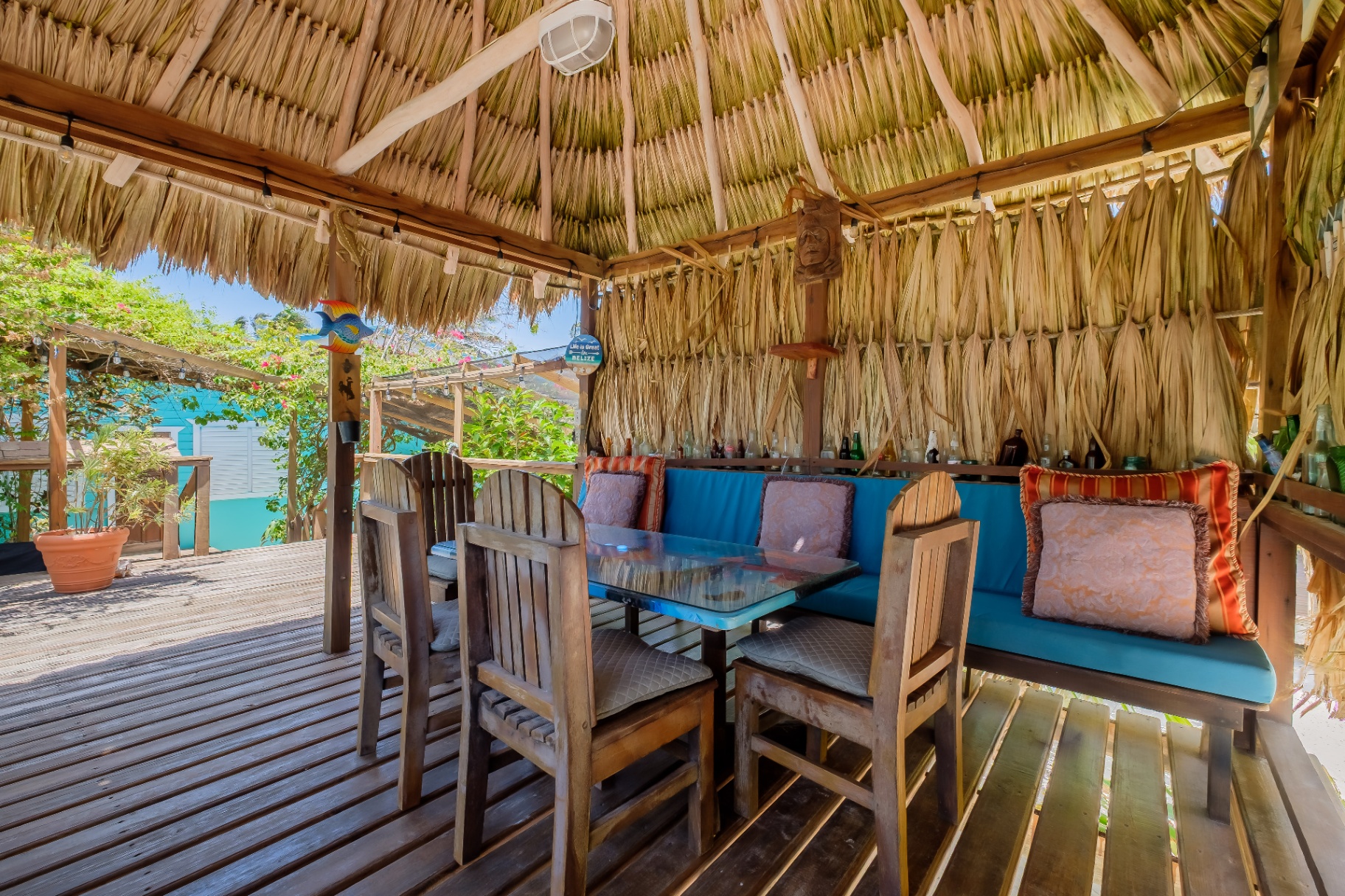 Thatched palapa bar with booth seating